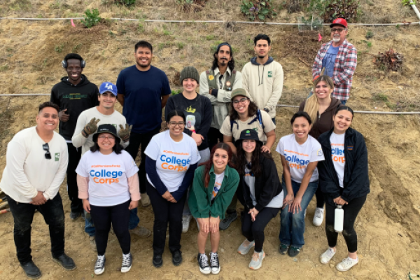 group in front of hill