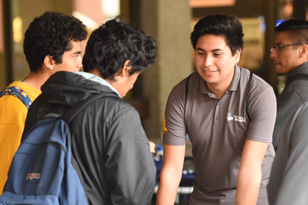 Baja student smiles at kids