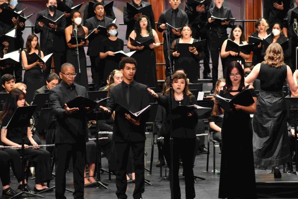 The University Choir and Wind Ensemble conducted by Dr. Emily Moss at the Luckman