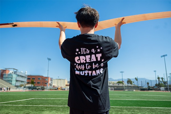 C3DPAC 2026 student holds UAV against blue sky