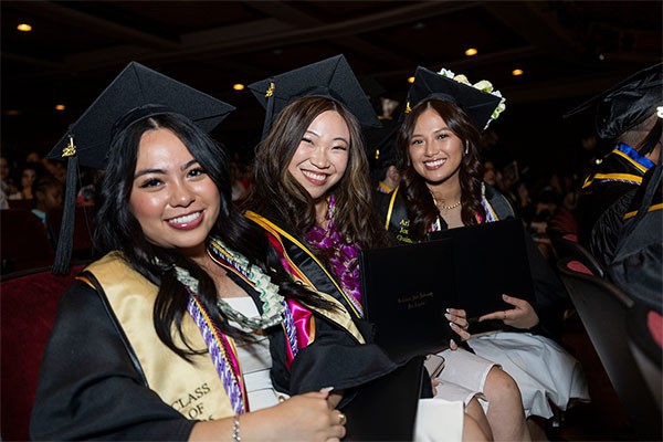 Students sitting and posing for camera