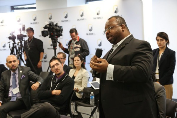 Latino Poll speaker engaged in presentation