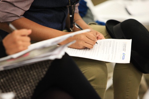 CivicU participants taking notes