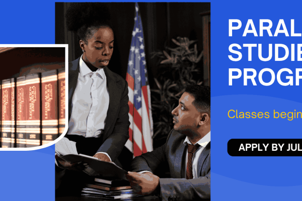 Paralegal and attorney working together at desk.