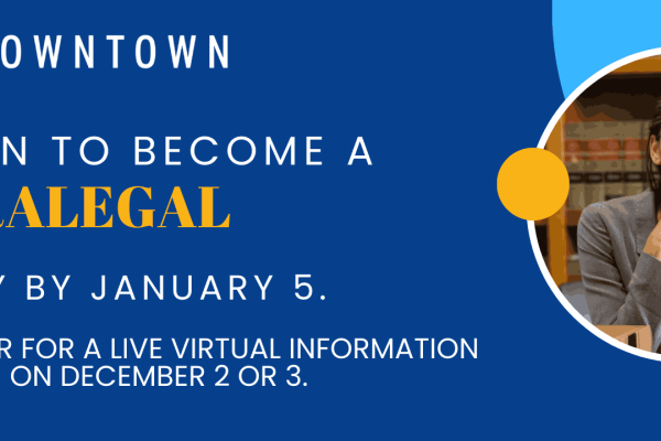 Female paralegal sits in law library. Law books. Cal State LA Downtown logo. 