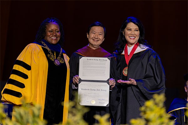 Ken Jeong receiving his honorary doctorate from President Eanes and Trustee Fong