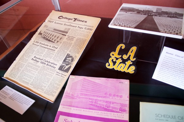 Alumni reunion memorabilia including a College Times issue from 1969 and LA State patch