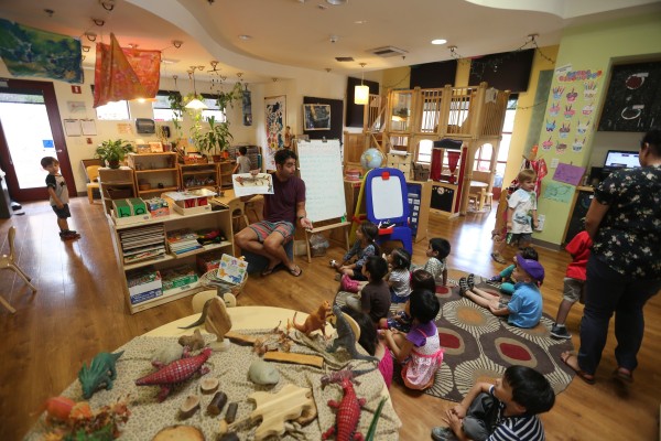 children being lectured in a seated circle