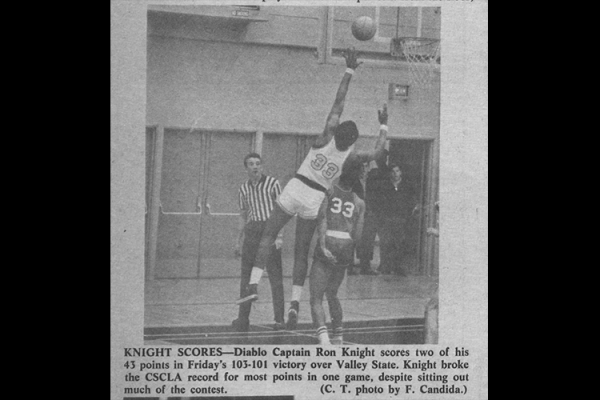 Diablos basketball with Captain Ron Knight scoring a basket