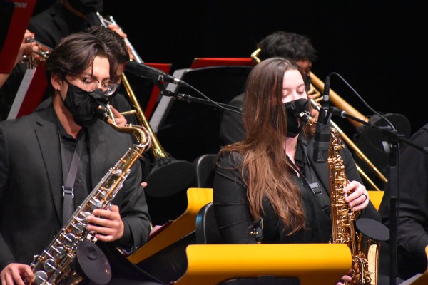 Two students playing saxophone