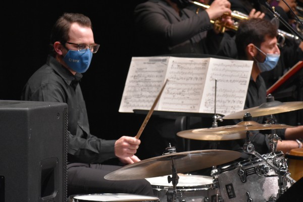 A drumset player playing in Jazz Ensemble