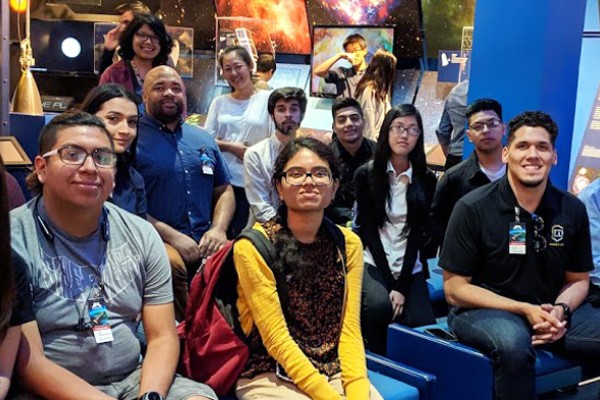 jpl trip students seated at exhibit