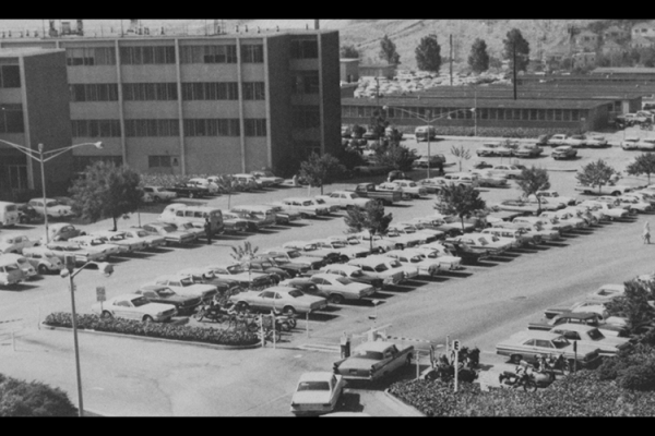 Birdseye view of cars parked in parking lot at Cal State LA