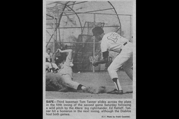 Cal State LA baseball player Tom Tanner slides on base