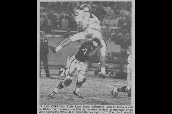 Two football players - Long Beach vs Cal State LA 