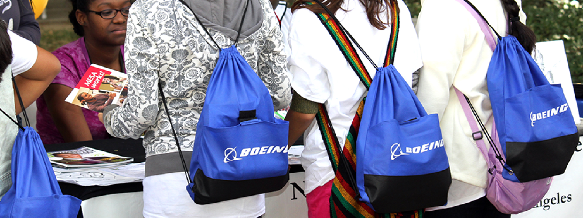 kids wearing Boeing bags