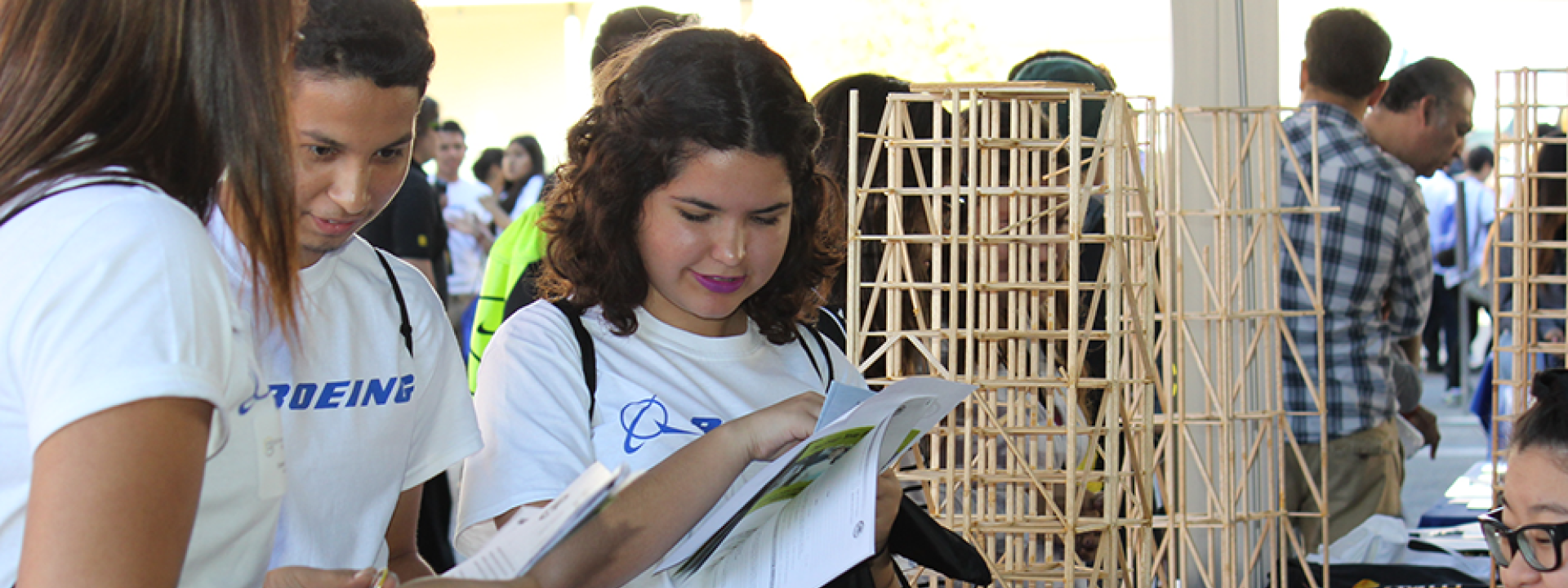 students stand by CE stick building project