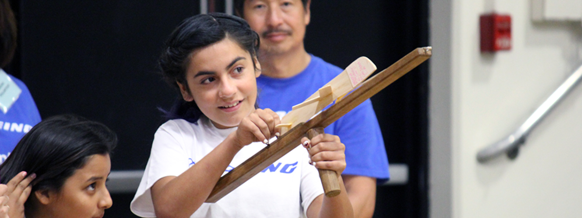 girl readies to launch plane