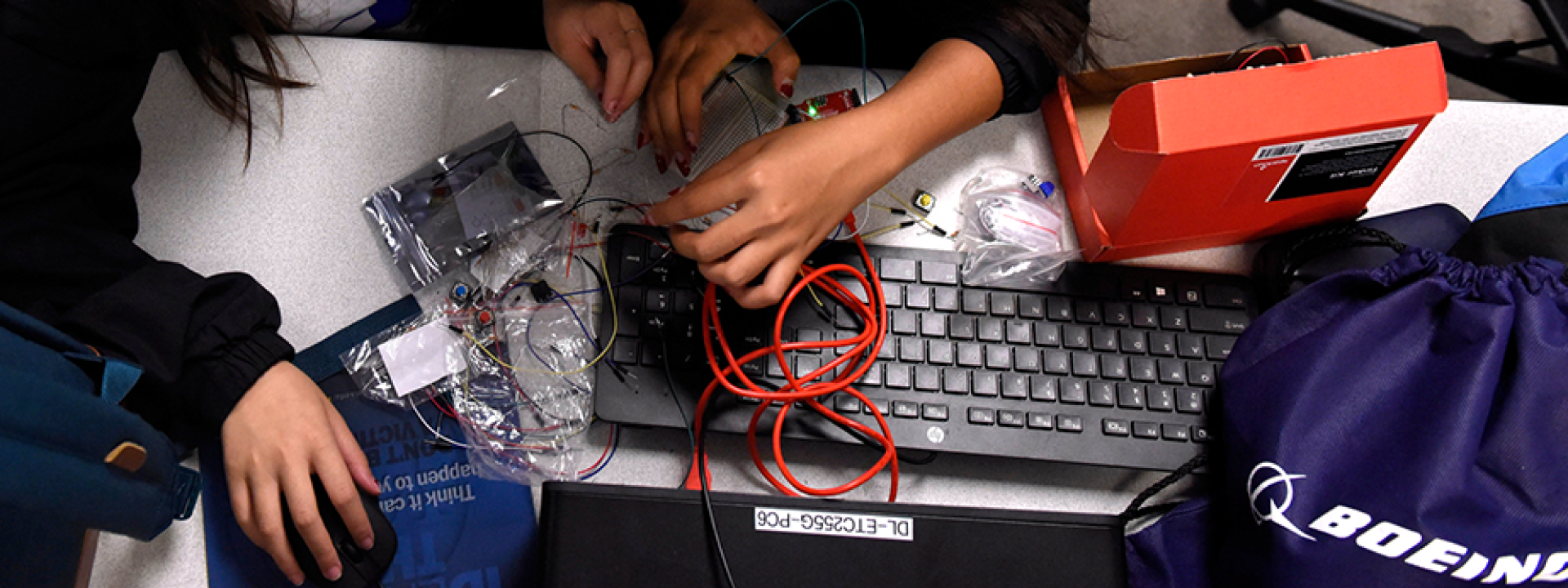 hands over keyboard in lab