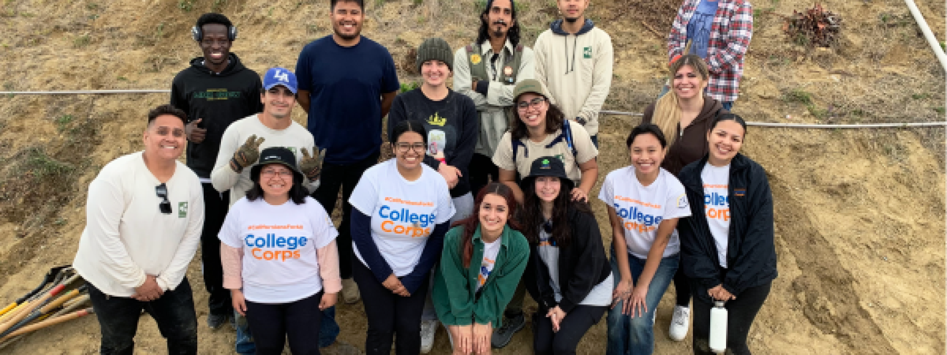 group in front of hill