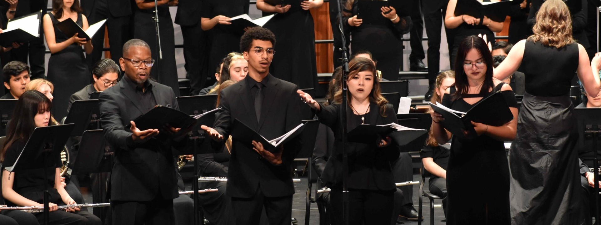 The University Choir and Wind Ensemble conducted by Dr. Emily Moss at the Luckman