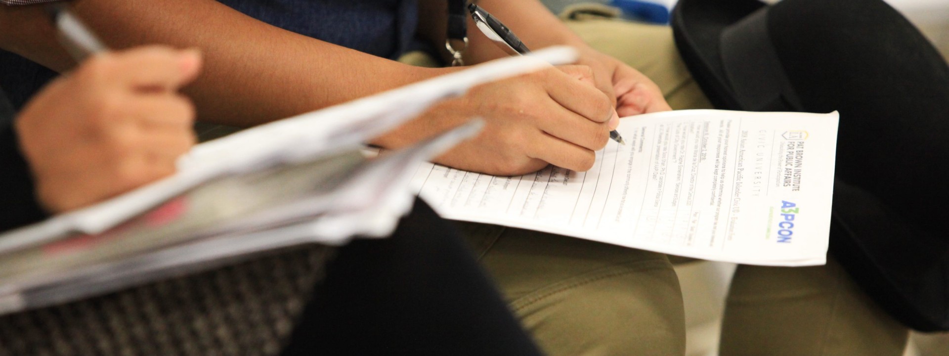 CivicU participants taking notes