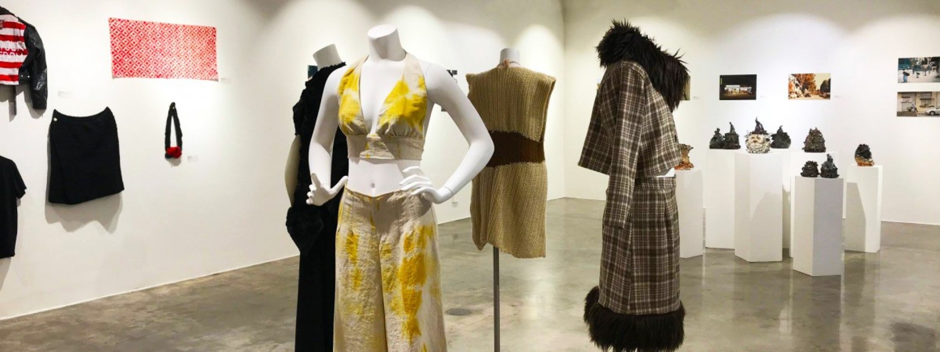 Mannequins in stylish clothing on display in the Ronald H. Silverman Fine Arts Gallery