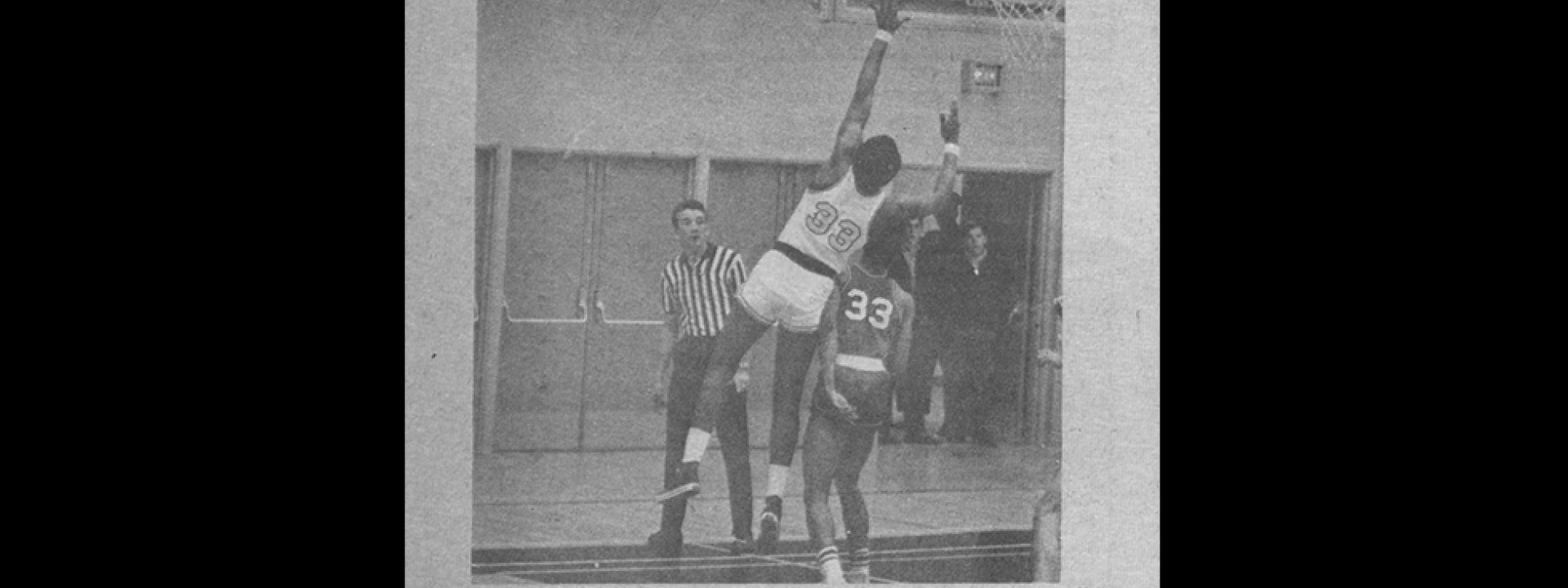 Diablos basketball with Captain Ron Knight scoring a basket