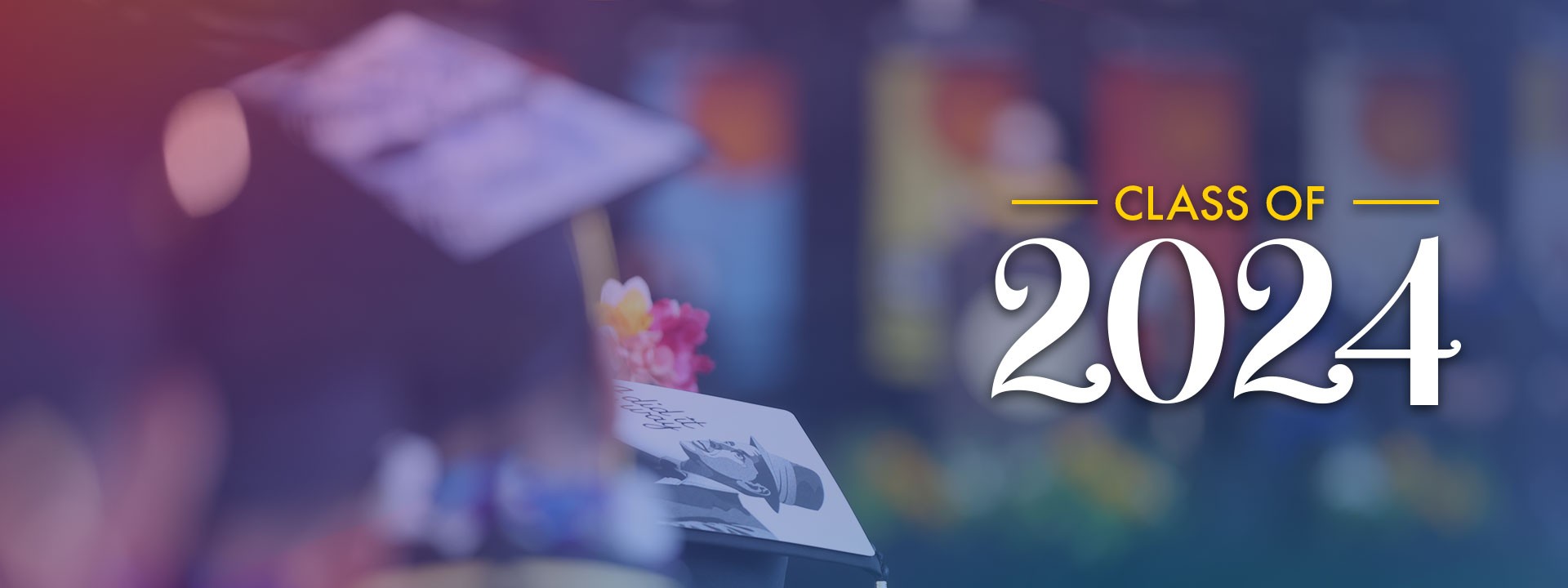 A student with a graduation cap on and a loco that says Class of 2024.