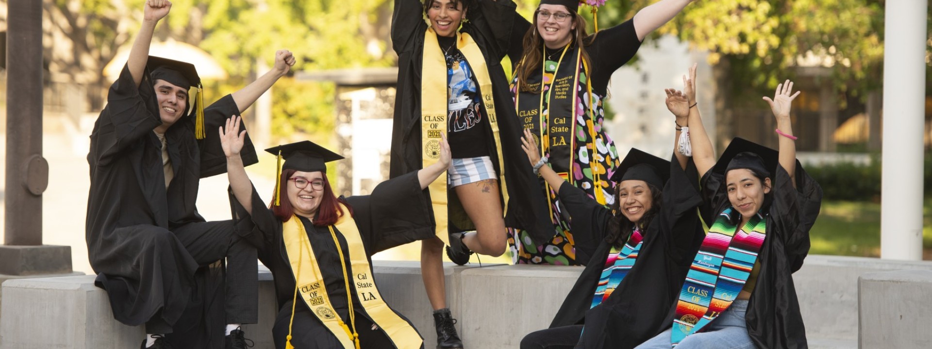 students celebrating graduation