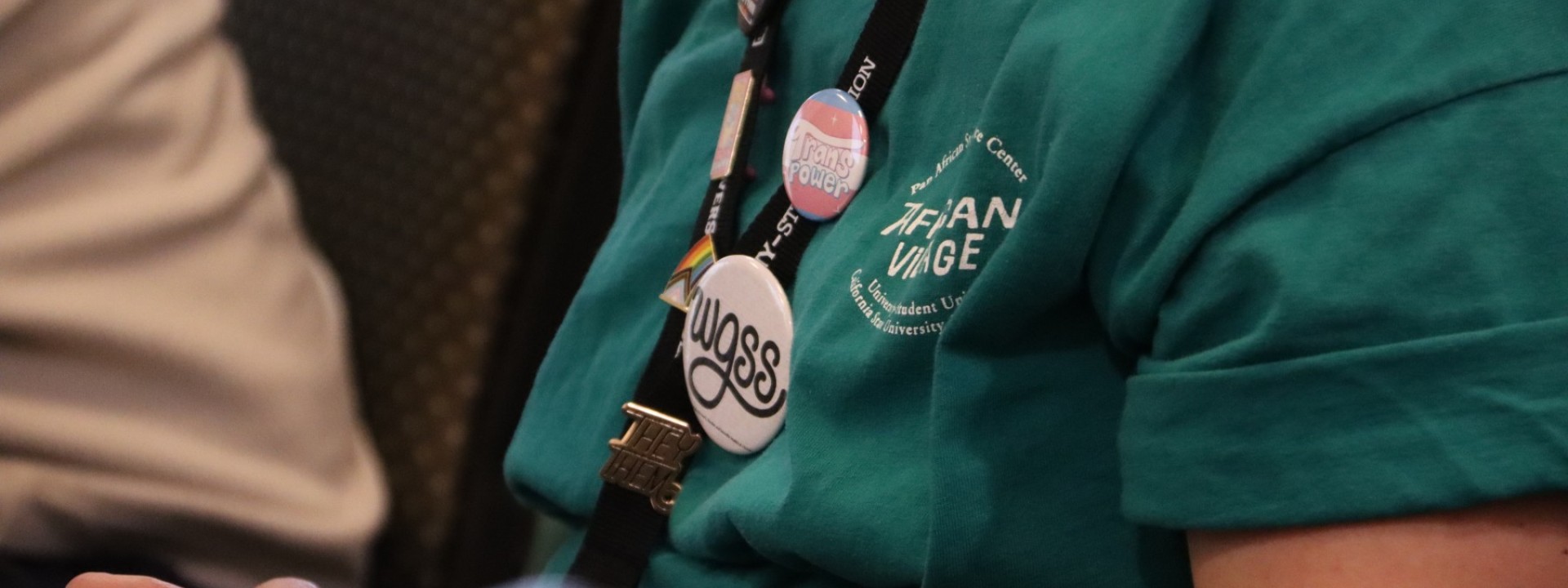 Student with WGSS Pins on a lanyard