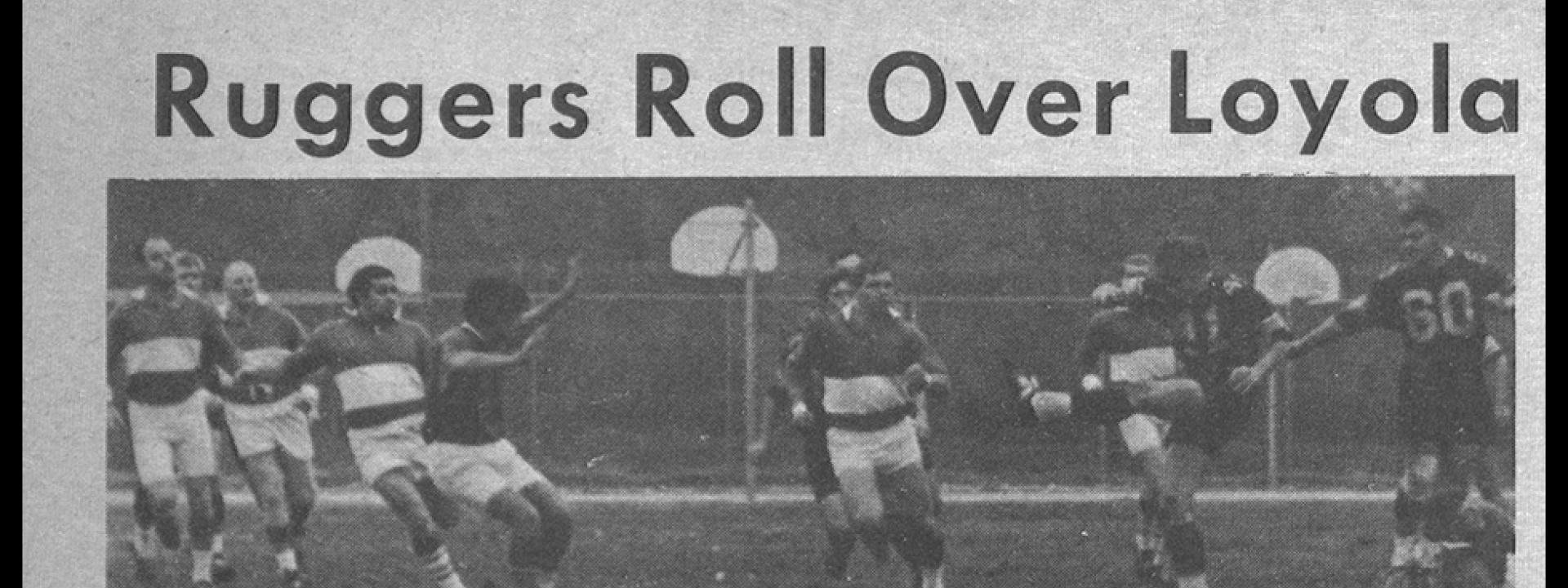 Men on soccer field. Text: Ruggers Roll Over Loyola. Diablos win 24:11