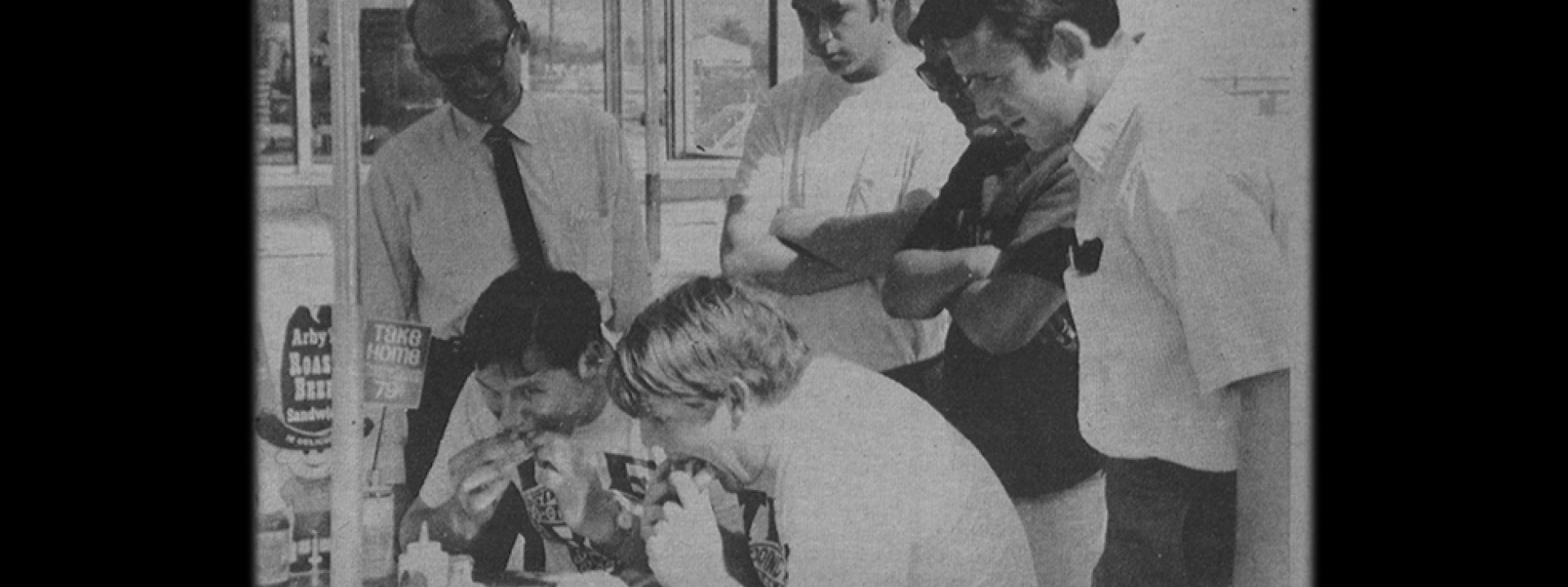 Tau Kappa Epsilon students eating roast beef sandwiches for eating contest