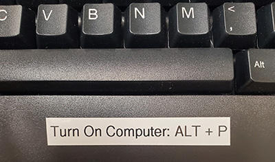 Keyboard with a label that reads Turn On Computer: ALT + P