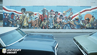 Elliott Pinkney mural on the side of a building depicting working men, stars and stripes