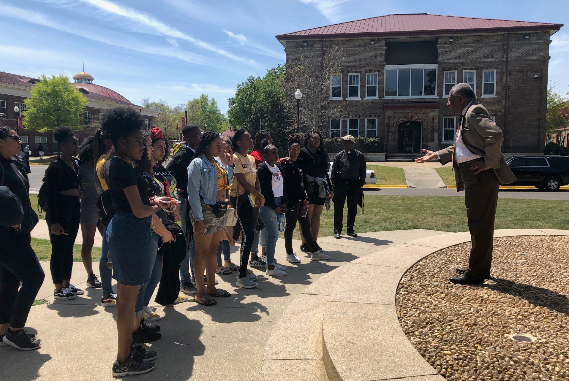 Students listen to tour guide