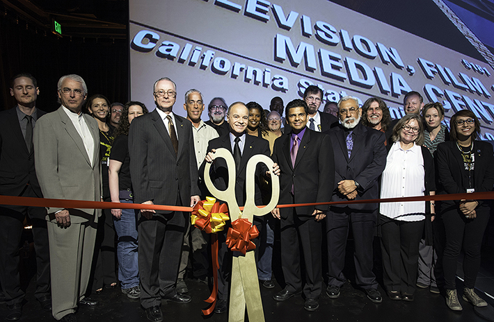President Covino gets ready to cut the ribbon at the grand opening of the Television, Film and Media Center.