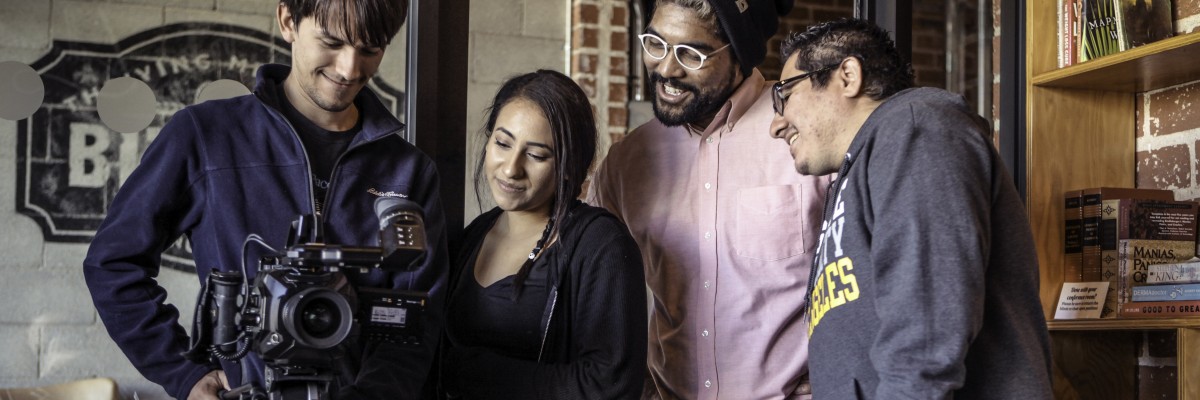 Group of students viewing camera screen