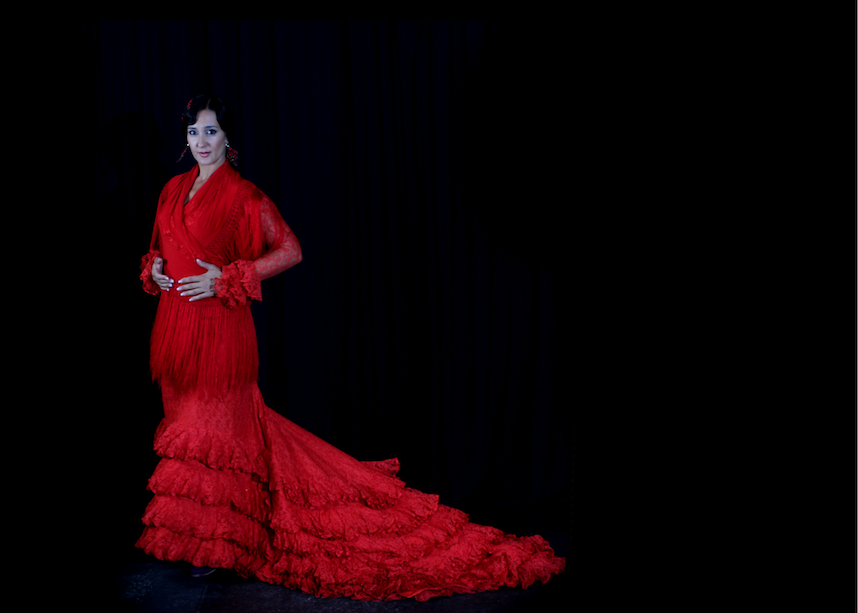Photo of María Carretero in a red dress.