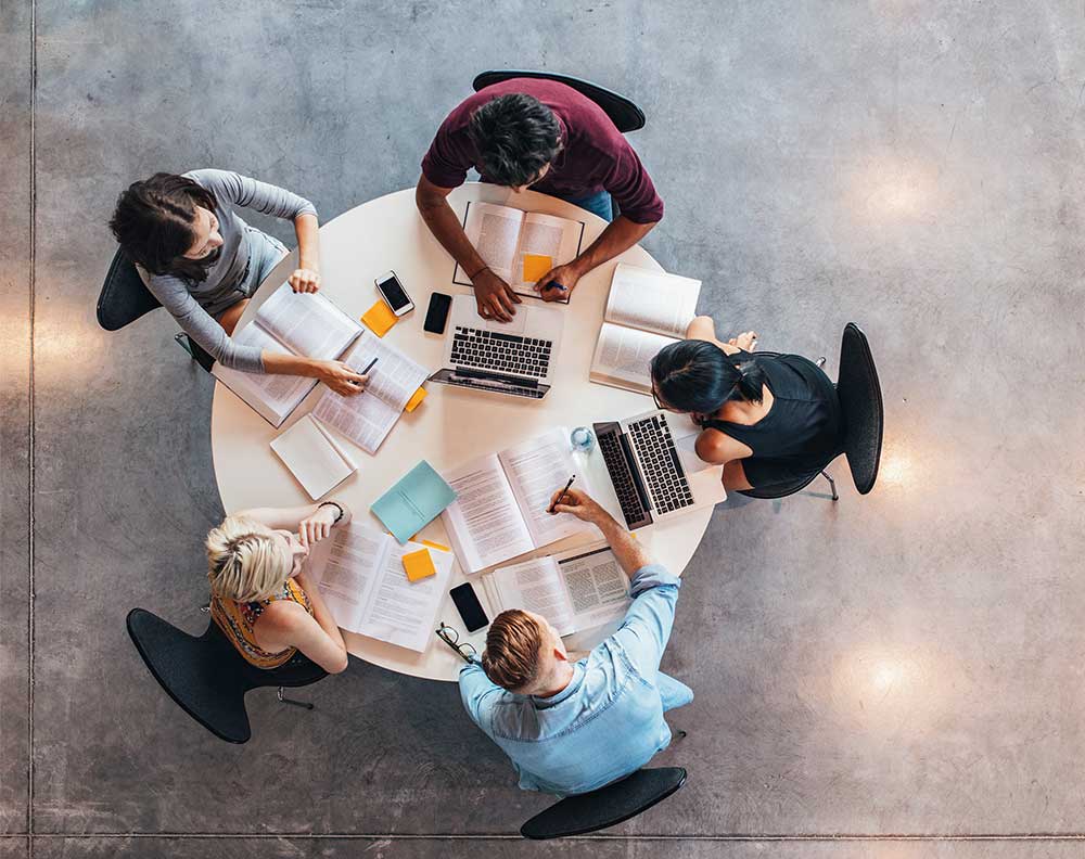 Students studying around a table